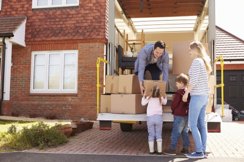 Removal team applying safe moving procedures during a property move