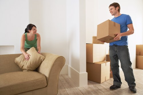 Professional movers loading furniture with care